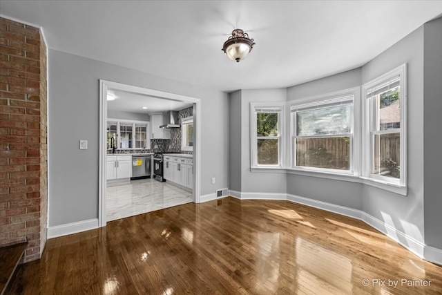 unfurnished living room featuring light hardwood / wood-style flooring