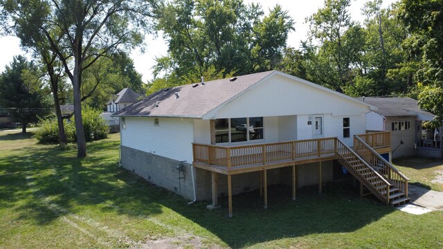 465 E Ash St, Watseka, IL 60970 - rear view of property with a wooden deck, a lawn, ceiling fan, and roof with shingles