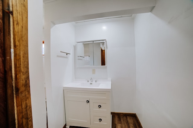 bathroom featuring vanity and hardwood / wood-style floors