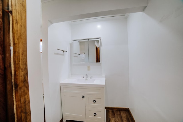 465 E Ash St, Watseka, IL 60970 - bathroom with vanity and wood finished floors