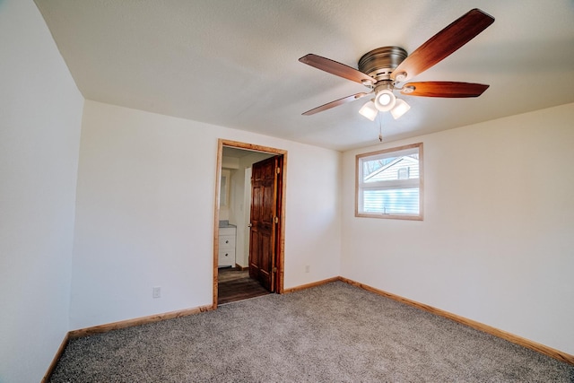 465 E Ash St, Watseka, IL 60970 - unfurnished bedroom featuring carpet floors, baseboards, a ceiling fan, and connected bathroom