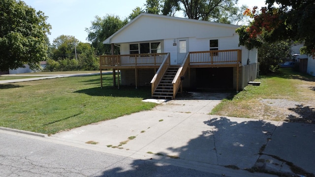 465 E Ash St, Watseka, IL 60970 - view of front facade featuring stairs, a front yard, a deck, and concrete driveway