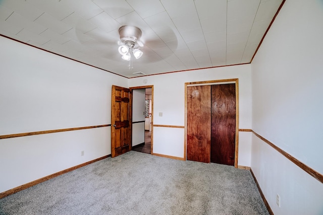 465 E Ash St, Watseka, IL 60970 - unfurnished bedroom with carpet floors, ceiling fan, baseboards, and a closet