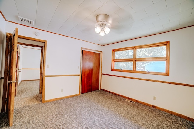 465 E Ash St, Watseka, IL 60970 - carpeted empty room featuring ceiling fan and baseboards