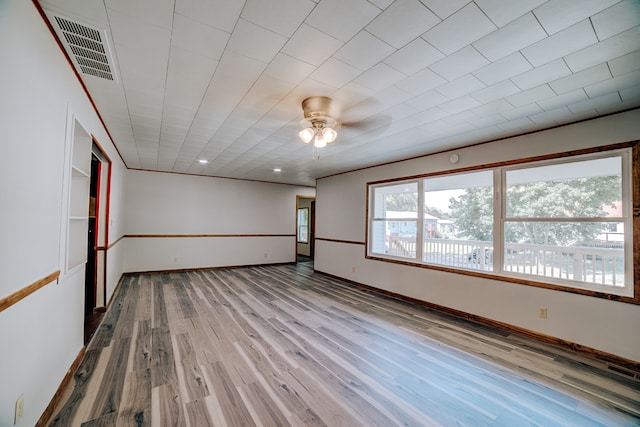 spare room featuring ceiling fan and light wood-type flooring