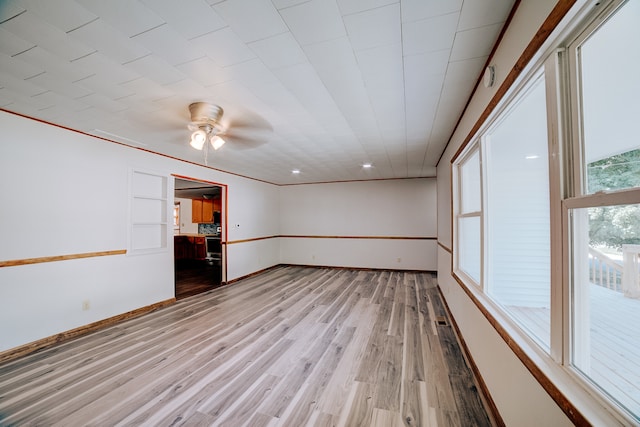 unfurnished room featuring ceiling fan and light hardwood / wood-style flooring