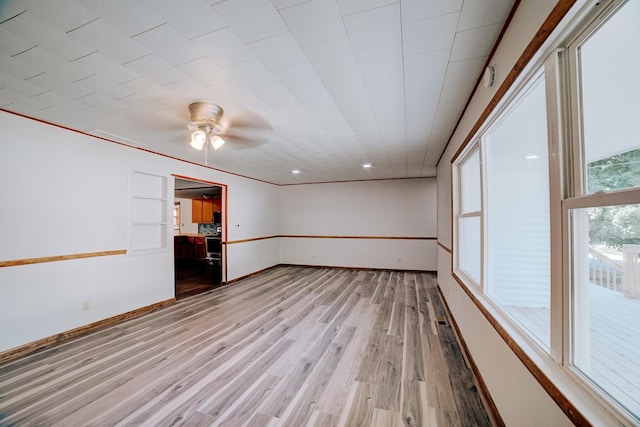 465 E Ash St, Watseka, IL 60970 - empty room with ceiling fan, light wood finished floors, and baseboards