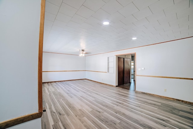 465 E Ash St, Watseka, IL 60970 - empty room featuring baseboards, wood finished floors, ceiling fan, and recessed lighting