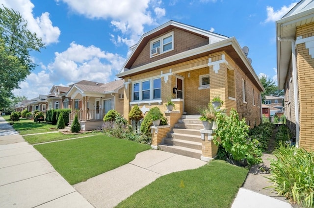 view of front of home with a front lawn and covered porch