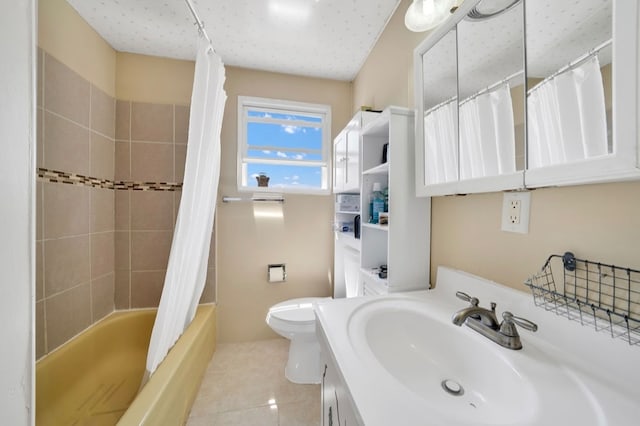 full bathroom with shower / tub combo with curtain, tile patterned flooring, vanity, and toilet