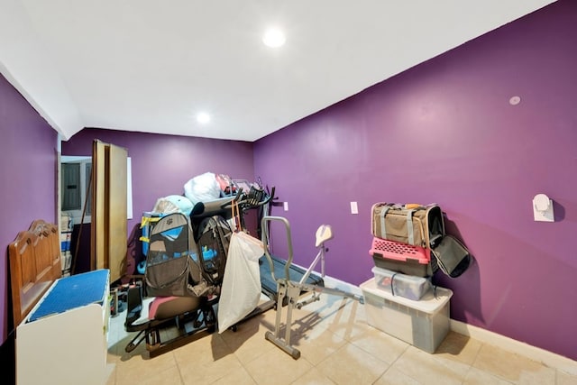 miscellaneous room with lofted ceiling and light tile patterned flooring