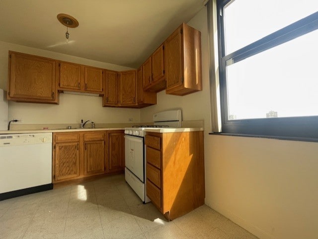 kitchen featuring sink and white appliances