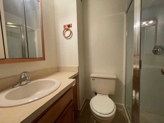 bathroom with vanity, toilet, and walk in shower