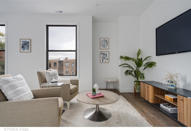 living room with dark hardwood / wood-style floors