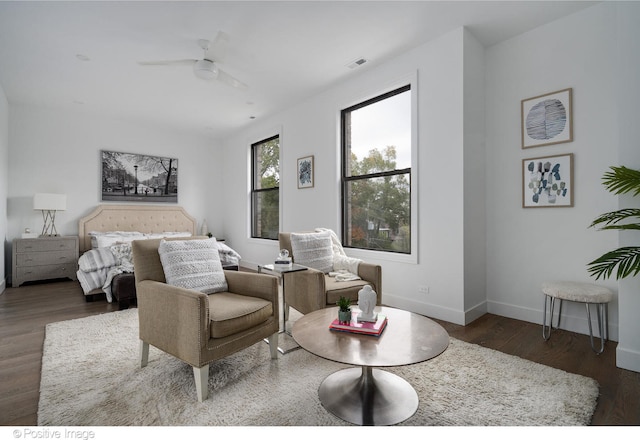 bedroom featuring ceiling fan and dark wood-type flooring