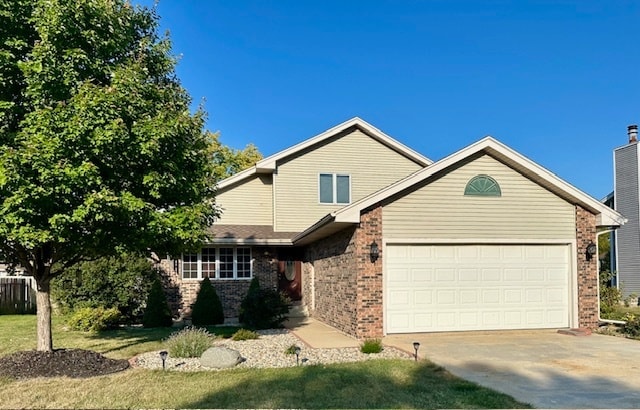 view of front of house featuring a garage and a front lawn