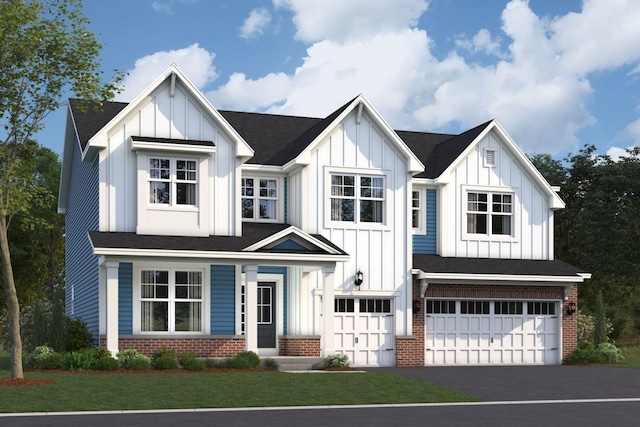 view of front of property featuring a front yard and a garage