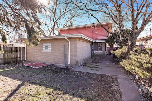 back of property featuring a patio area