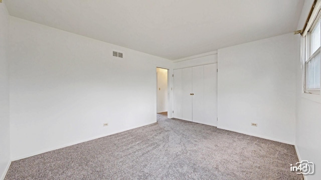 732 Luau Dr, Des Plaines, IL 60016 - unfurnished bedroom with carpet, a closet, and baseboards