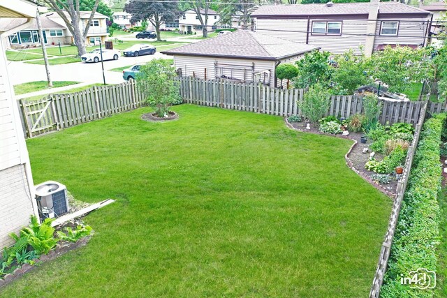 732 Luau Dr, Des Plaines, IL 60016 - view of yard with central AC and a residential view