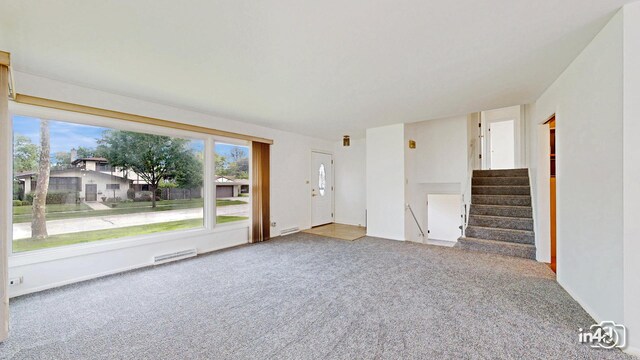 732 Luau Dr, Des Plaines, IL 60016 - unfurnished living room featuring carpet floors and stairway