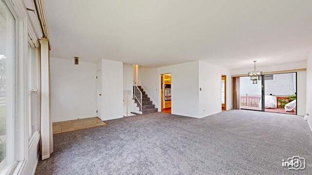 732 Luau Dr, Des Plaines, IL 60016 - carpeted spare room with a chandelier, stairs, and baseboards