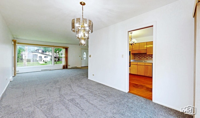 732 Luau Dr, Des Plaines, IL 60016 - carpeted empty room with a chandelier and baseboards