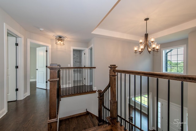 25W275 Doris Ave, Carol Stream, IL 60188 - staircase featuring a chandelier, wood finished floors, and a tray ceiling