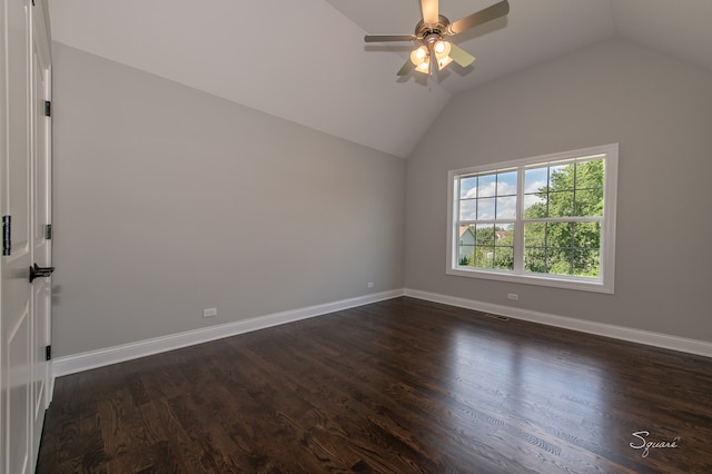 unfurnished room featuring lofted ceiling, ceiling fan, and dark wood-type flooring