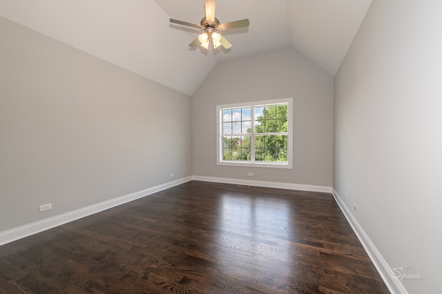 unfurnished room featuring ceiling fan, vaulted ceiling, and dark wood-type flooring