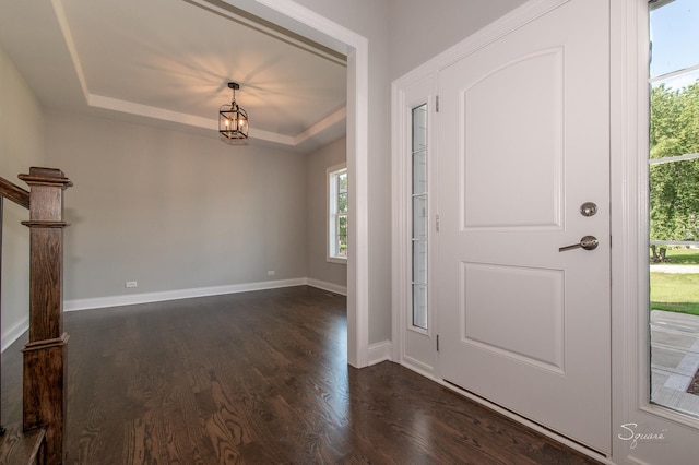 25W275 Doris Ave, Carol Stream, IL 60188 - entryway featuring dark wood finished floors, a raised ceiling, and a chandelier