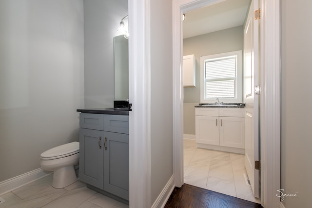 bathroom featuring vanity and toilet