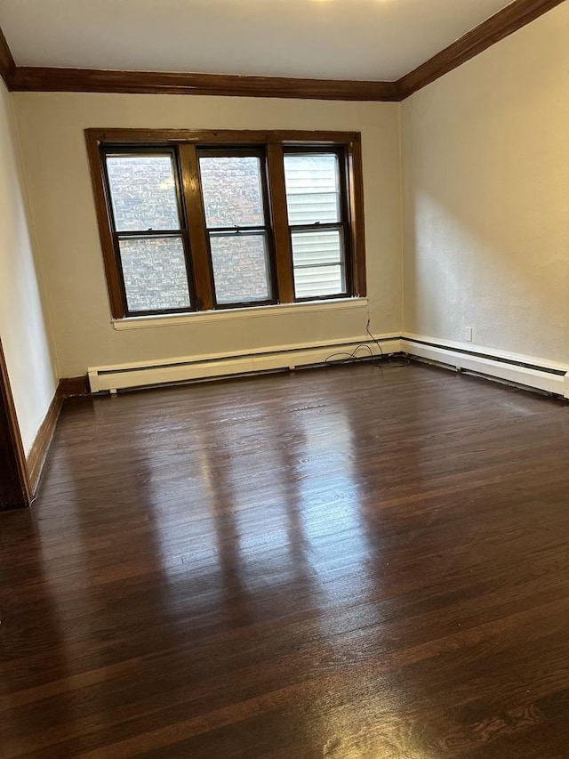 unfurnished room featuring ornamental molding and dark wood-type flooring