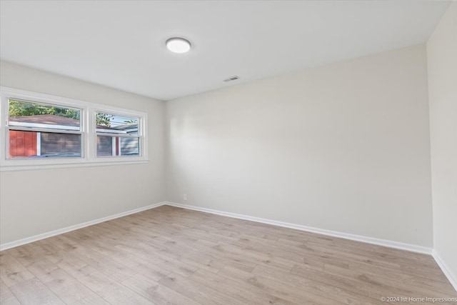 unfurnished room featuring light wood-type flooring