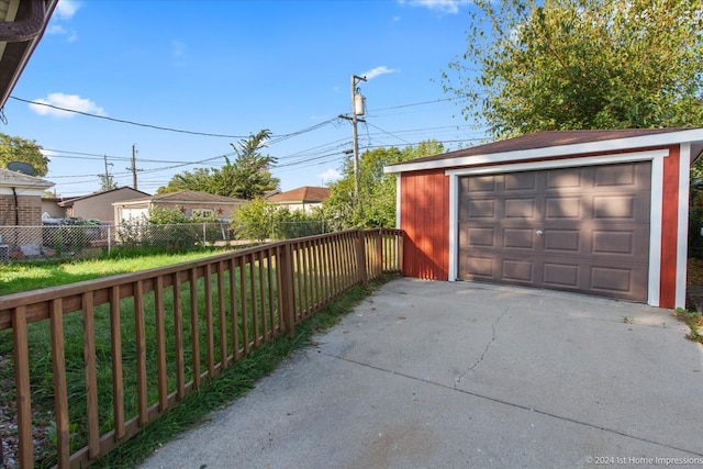 garage featuring a lawn