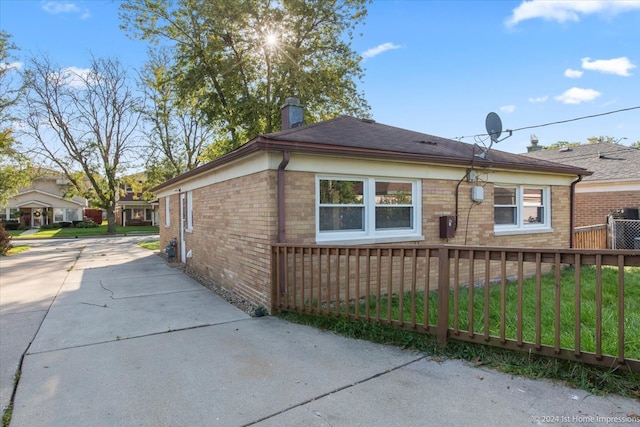 view of property exterior featuring a lawn