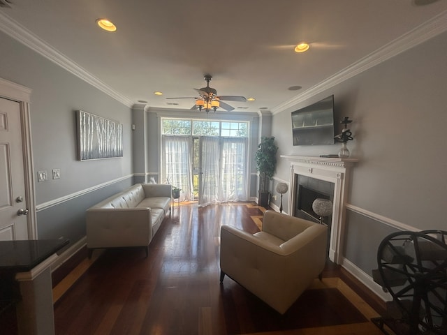 living room featuring crown molding, ceiling fan, and dark wood-type flooring