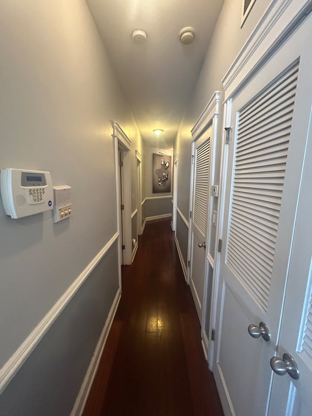 hallway featuring dark hardwood / wood-style floors