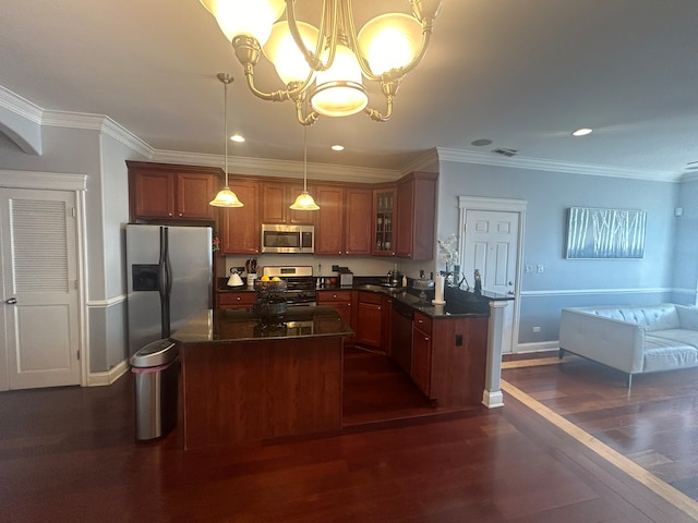 kitchen featuring decorative light fixtures, appliances with stainless steel finishes, crown molding, and dark wood-type flooring