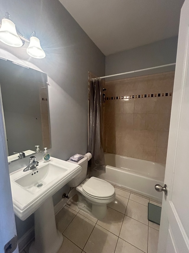 bathroom with shower / bath combination with curtain, tile patterned floors, and toilet