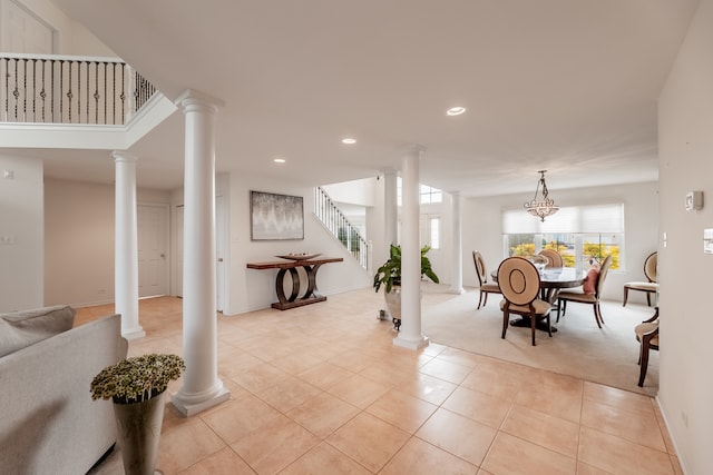 carpeted dining space featuring a notable chandelier