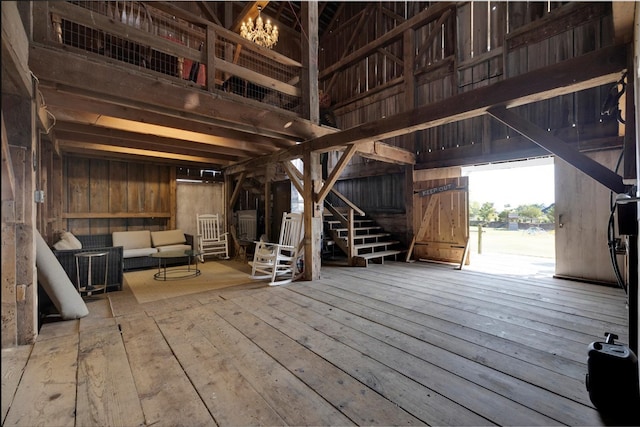 interior space with wood-type flooring and wooden walls