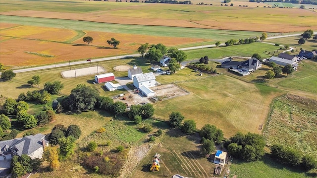 birds eye view of property with a rural view