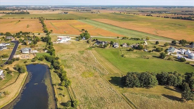 birds eye view of property with a rural view and a water view