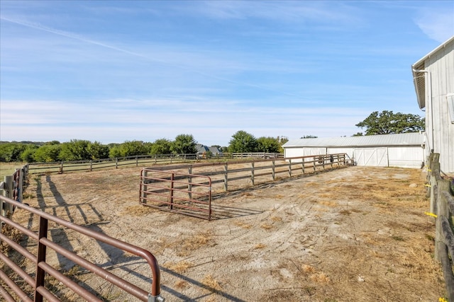 view of yard with a rural view