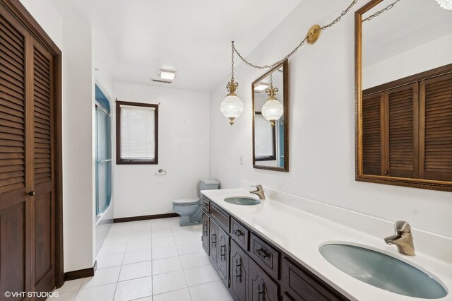 full bathroom with enclosed tub / shower combo, vanity, toilet, and tile patterned floors