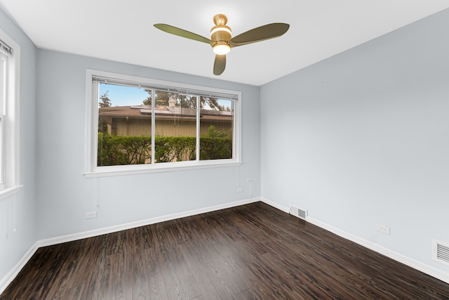 spare room featuring dark hardwood / wood-style floors and ceiling fan