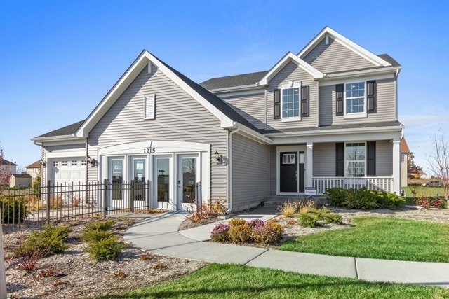 view of front of home with a garage and a porch