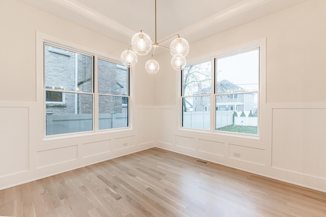 unfurnished dining area with light hardwood / wood-style floors