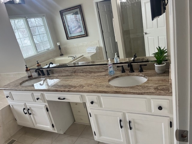 bathroom featuring tile patterned flooring and vanity